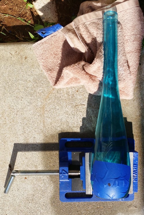 cover_the_area_with_tape_before_drilling_hole-DIY_bottle_lamp