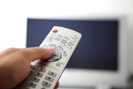 tv remote control with big flatscreen at the back